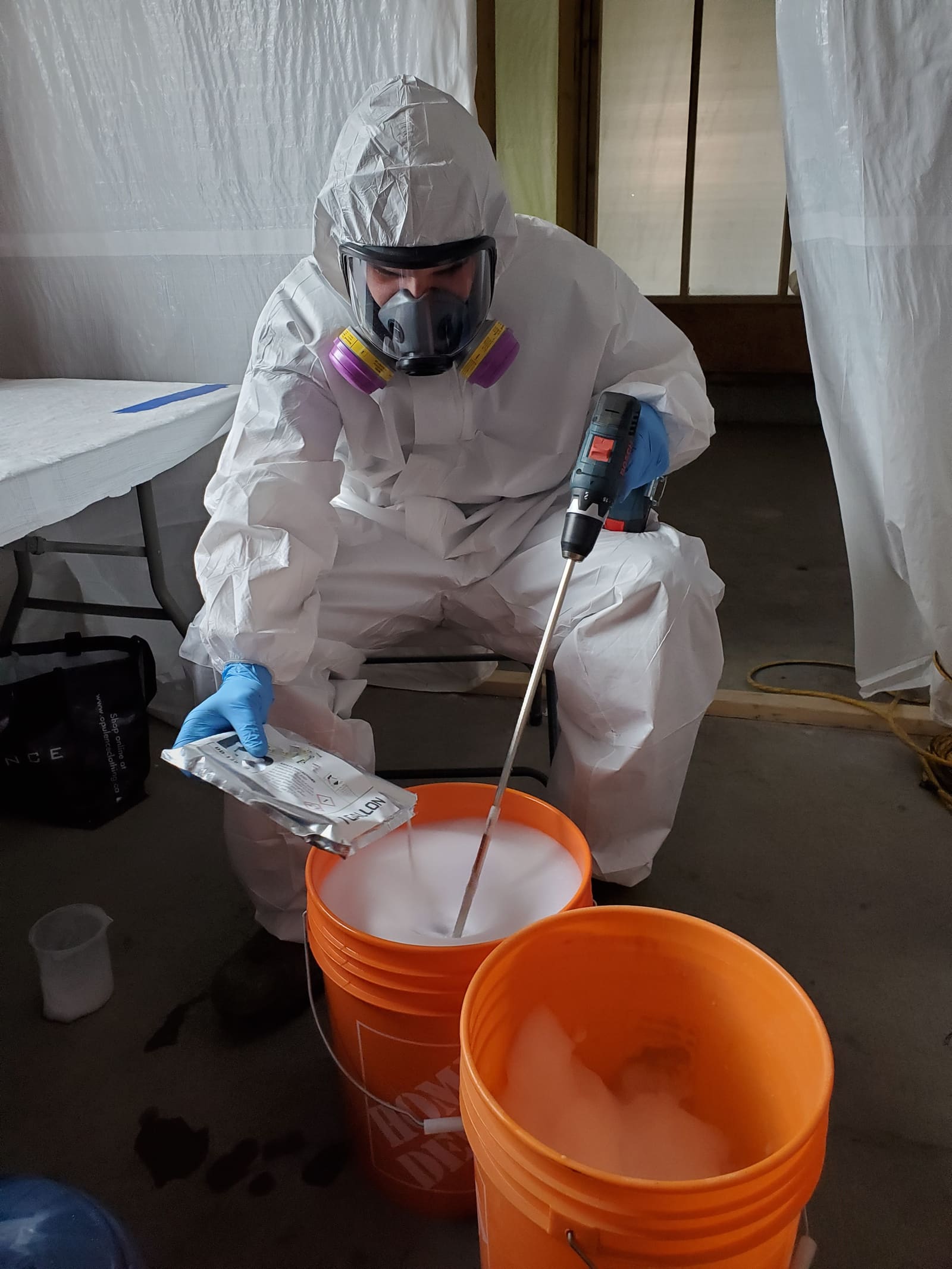 Diamond Decontamination technician in protective equipment